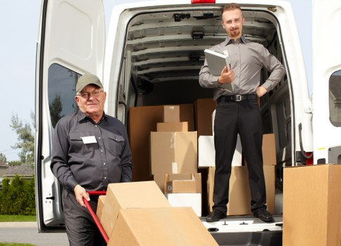 Moving team loading furniture carefully for a Kennington house relocation
