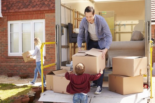 Packed moving boxes and furniture ready for transport