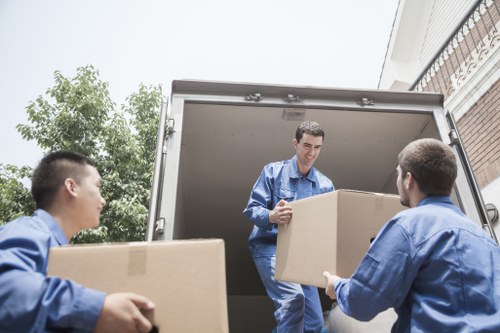Local Kennington movers organising boxes and fragile items during relocation