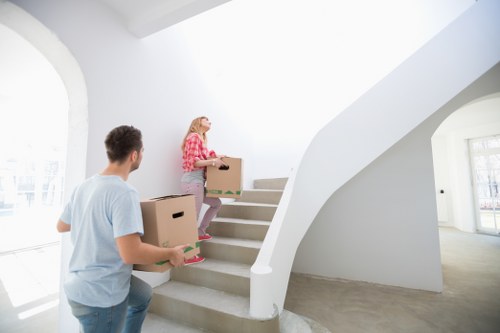 Office furniture and boxes arranged for a Kennington commercial move
