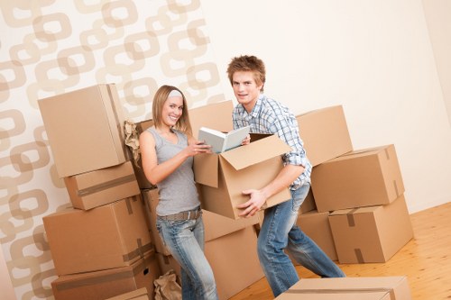 Professional movers loading items in a Kennington street