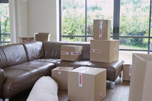 Packed moving boxes and furniture ready for transport by Kennington movers