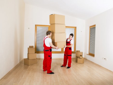 Removal workers following health and safety checks before starting work